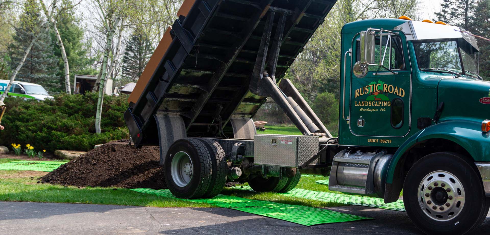 A 6 ton truck of dirt backed up on bam bad ass mats