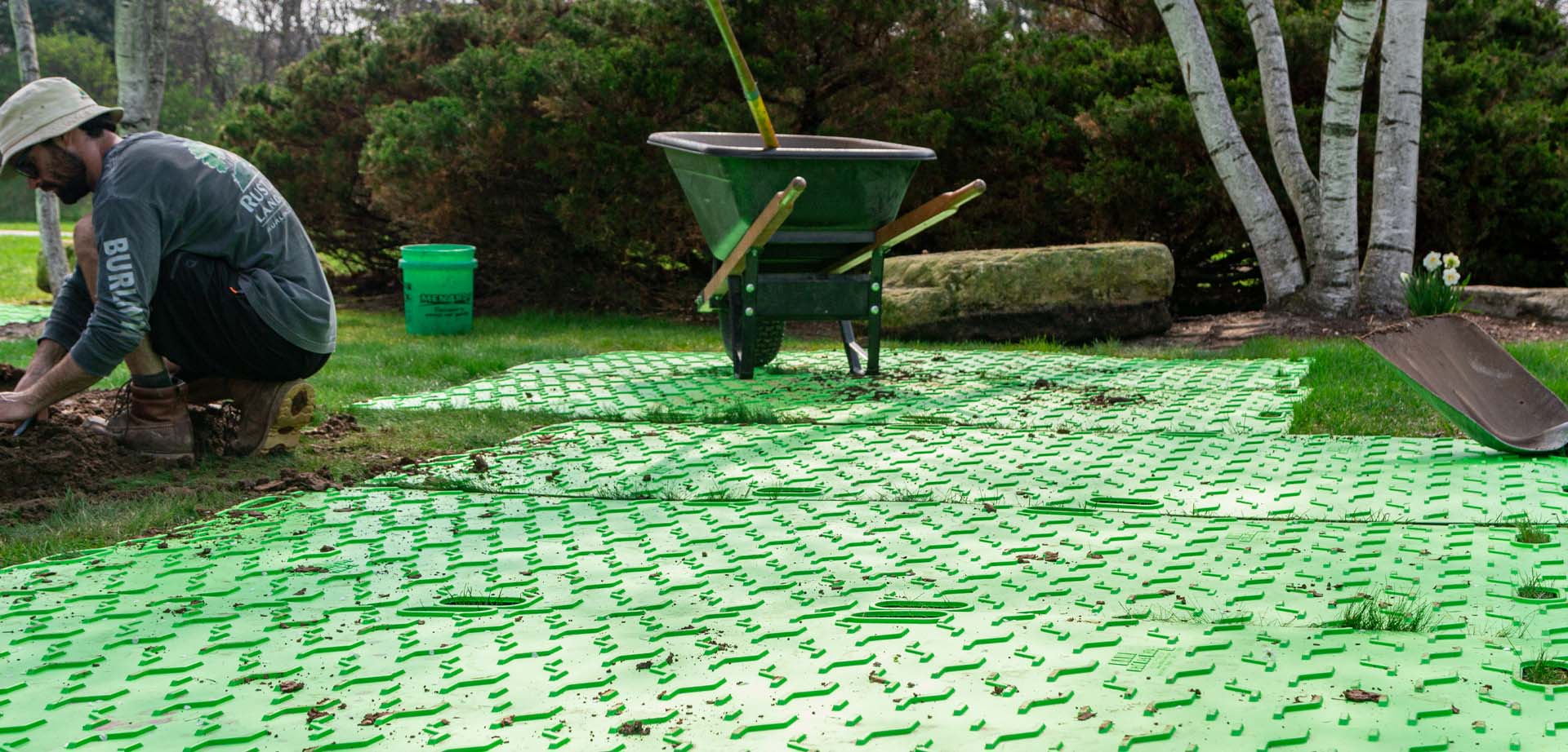a group of bam bad ass mats with a wheelbarrow on them